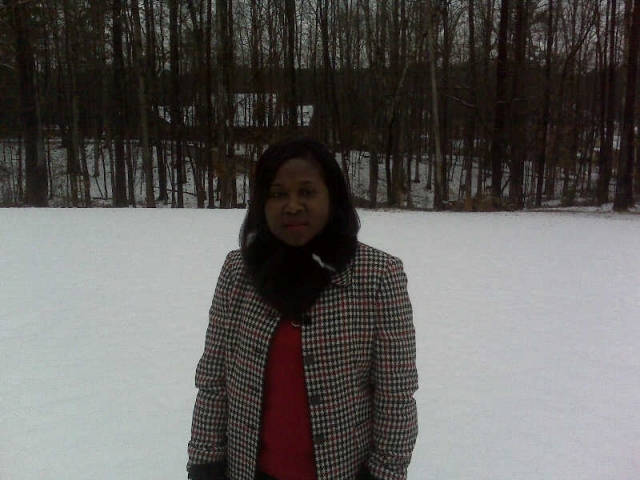 Carolyn in front yard in the snow